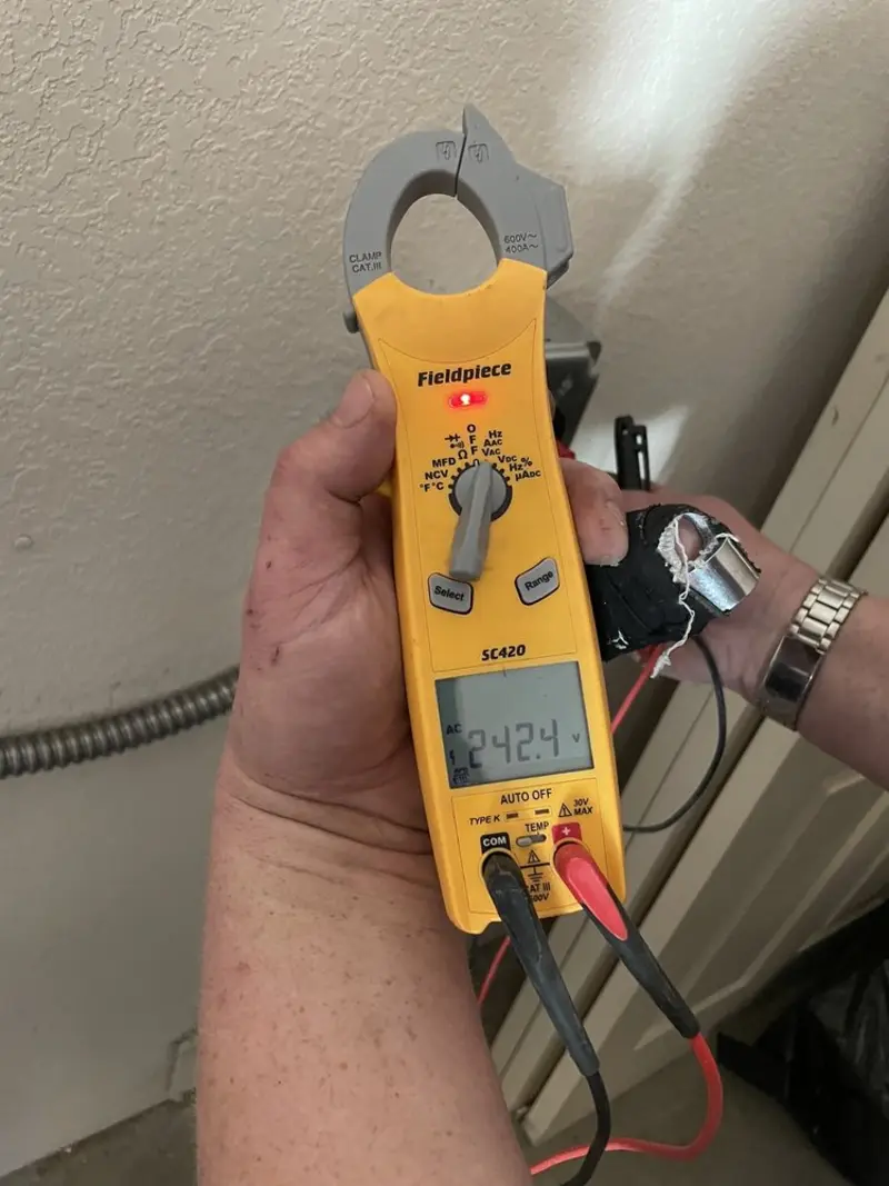 Voltage testing with clamp meter during Generator Installation in Palm Bay